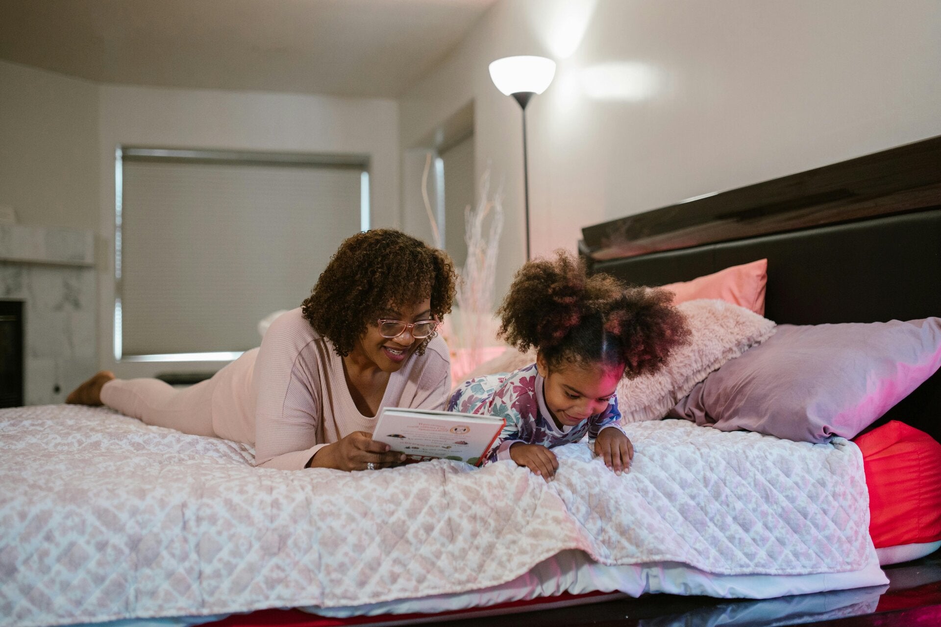A cozy mommy and daughter moment before bed the warmth of knowing your loved ones are safe and secure.