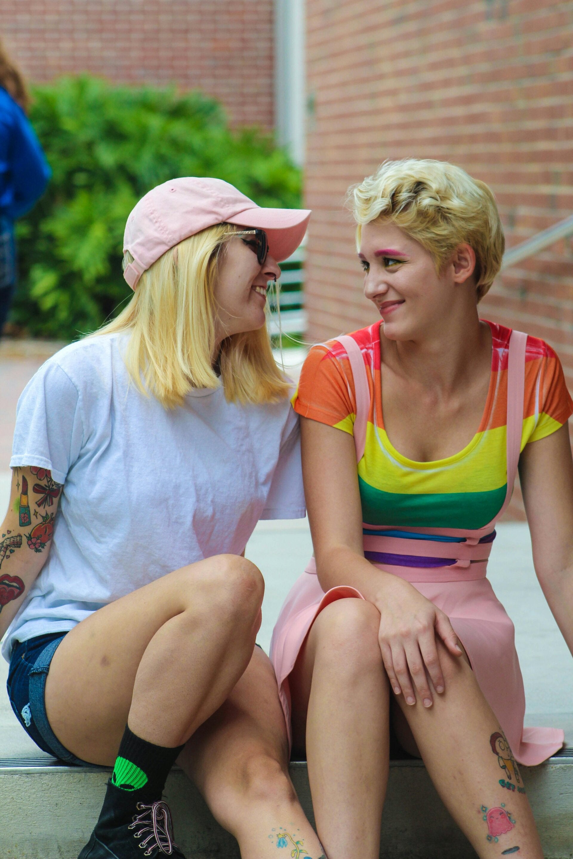 two women sitting together smiling