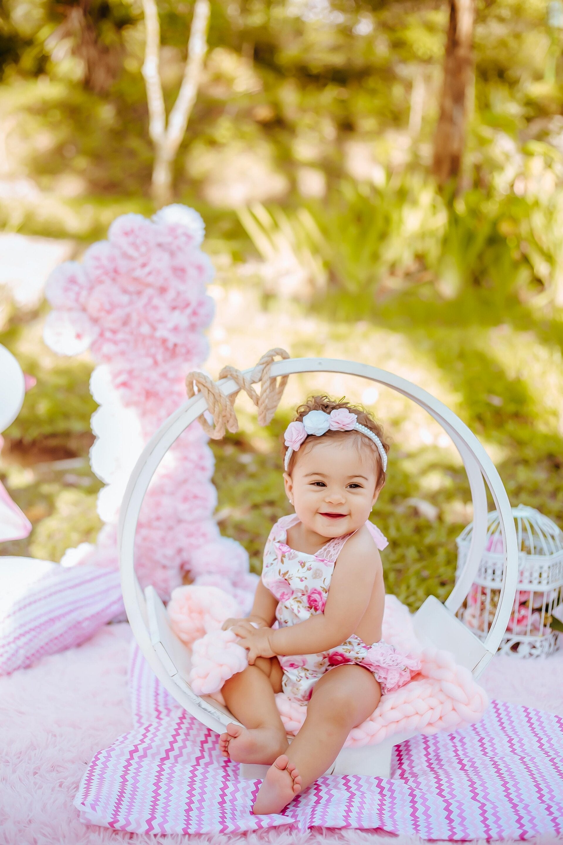 A beautifully styled baby girl in floral attire, illustrating how Shelley Whizin helps families co-create magical life ceremonies