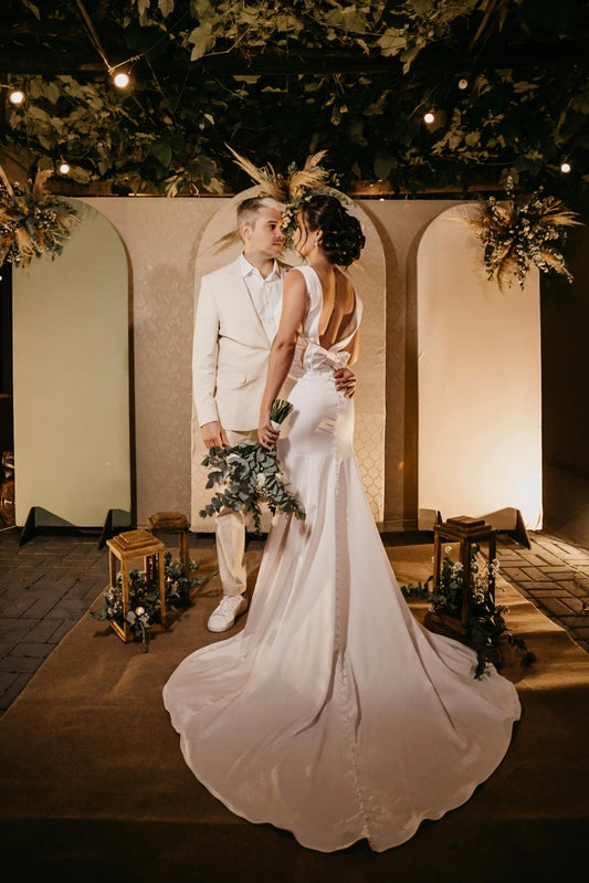 Couple exchanging vows during an intimate backyard wedding ceremony