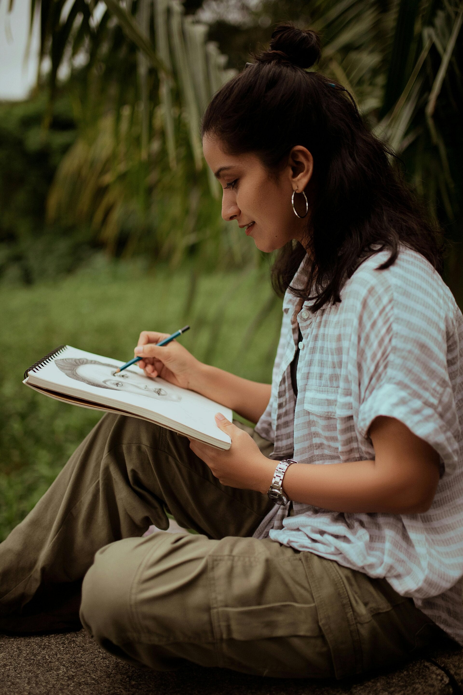 a sketch of outside things in liverpool. buildings, one with a round roof. a drawing of a stone angel