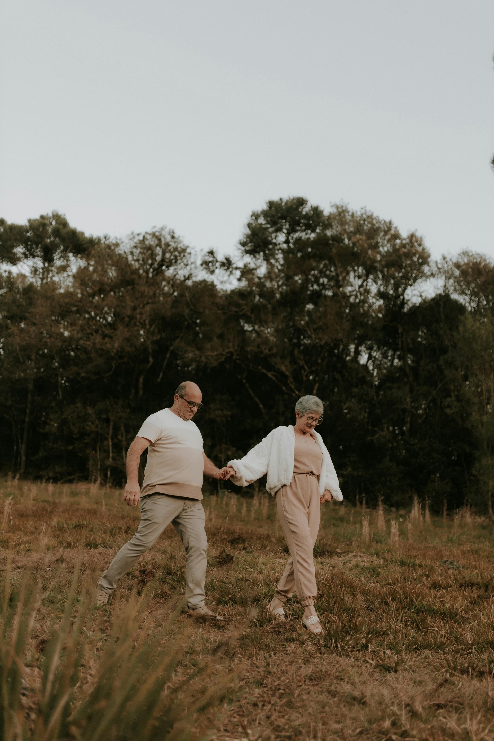 older couple walking holding hands