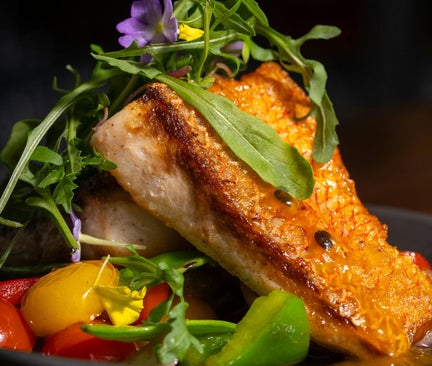 perfectly seared halibut with assortment of fresh veggies