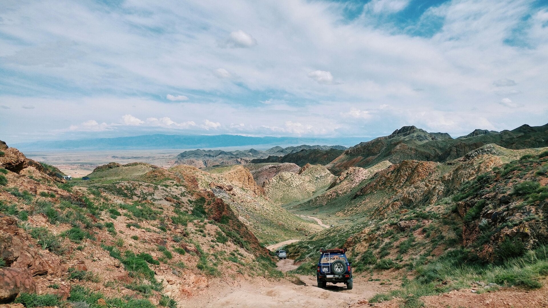A high‑angle view looking down on the Upper Salt River with surrounding canyon walls and distant mountains in the background near Gleason Flat, Arizona. 