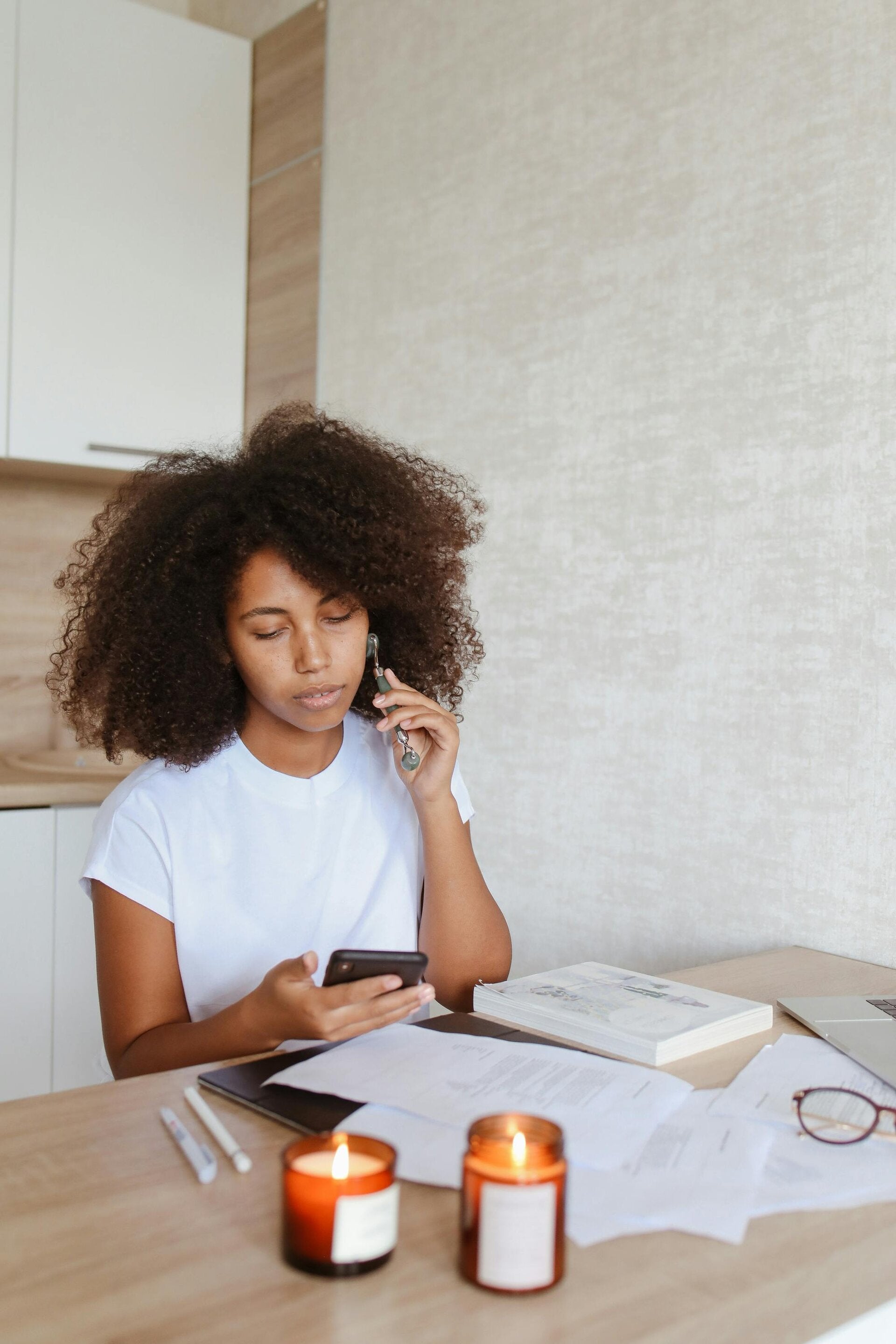 A mother looks through paperwork at the table, reviewing coverage options.