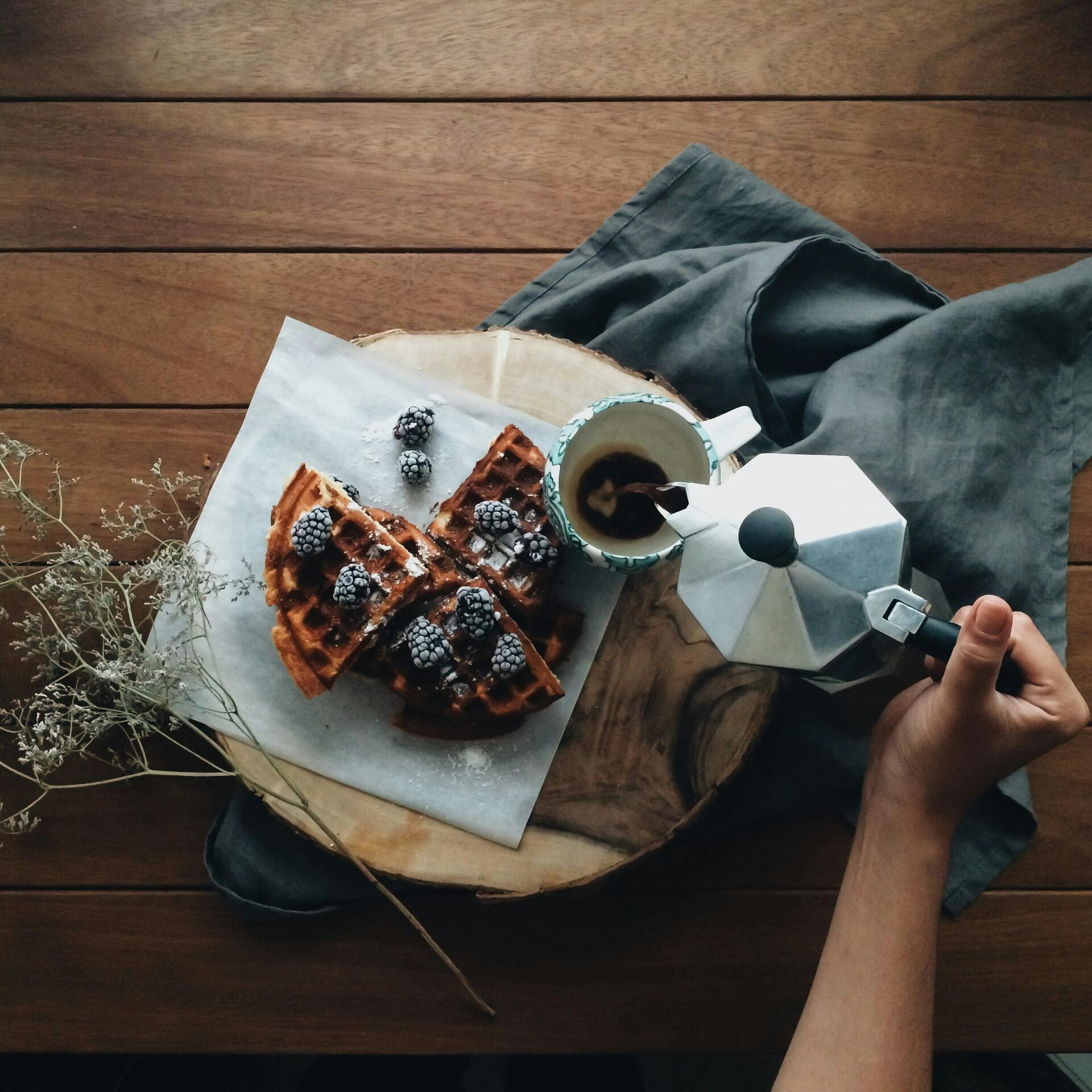 Golden brown Cannabis Waffles topped with syrup, a perfect breakfast choice for cannabis edibles and Stoner Strategies readers