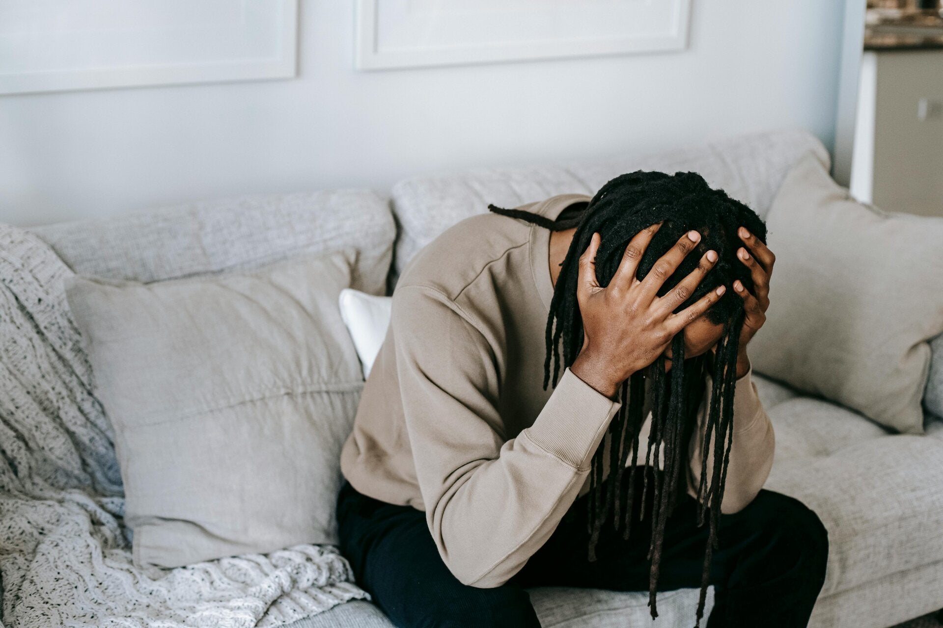 Person feeling overwhelmed by thoughts and mental stress