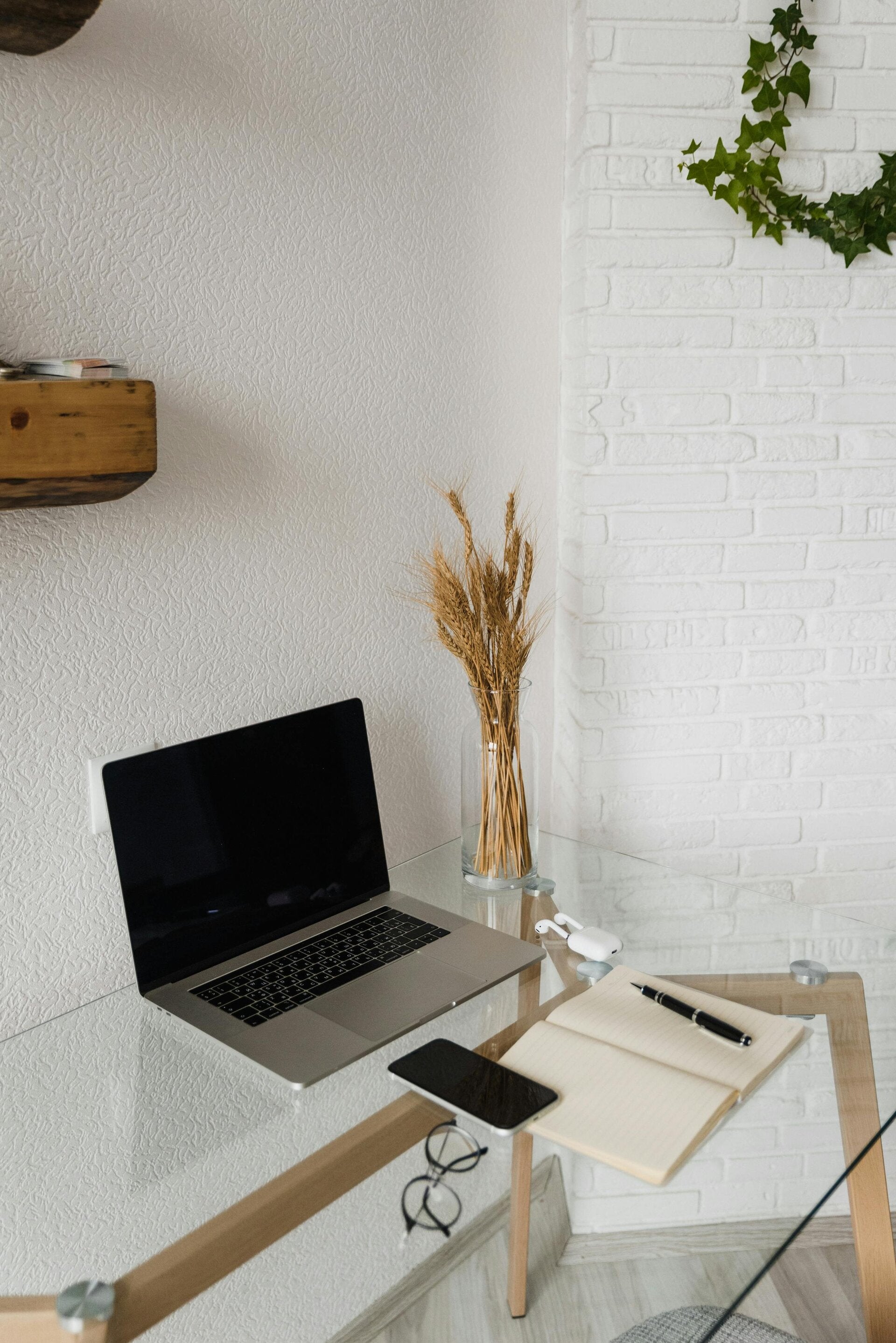 Clean, organized desk with a laptop in a distraction-free setup, symbolizing productivity, clarity, and focused work-from-home routines.
