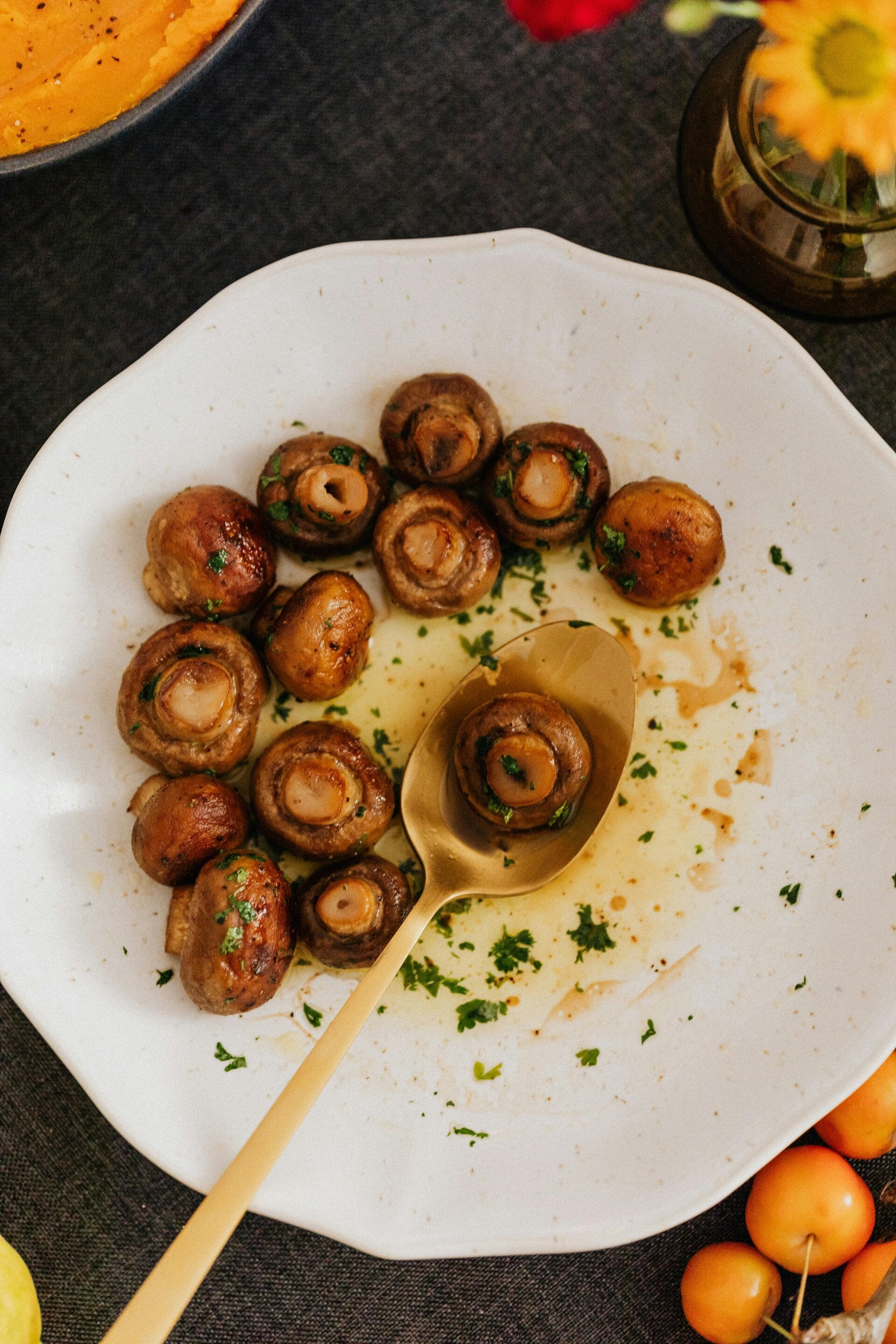 A plate of golden Sauteed Cannabis Mushrooms, the perfect side dish for cannabis edibles and Stoner Strategies enthusiasts