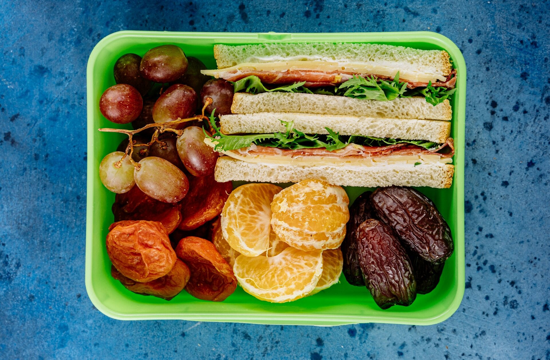 A packed lunch laid out on a picnic surface, used to remind off‑road tour guests to bring a small cooler and lunch for their Gleason Flat Salt River adventure.