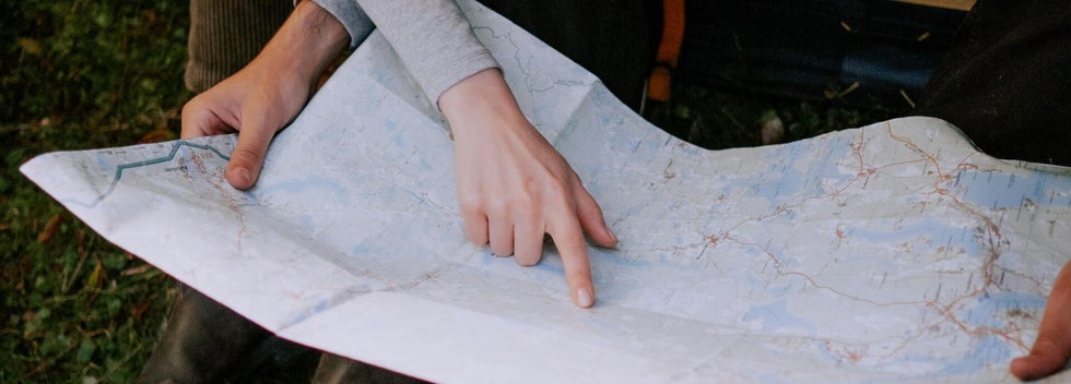 two people reading a map