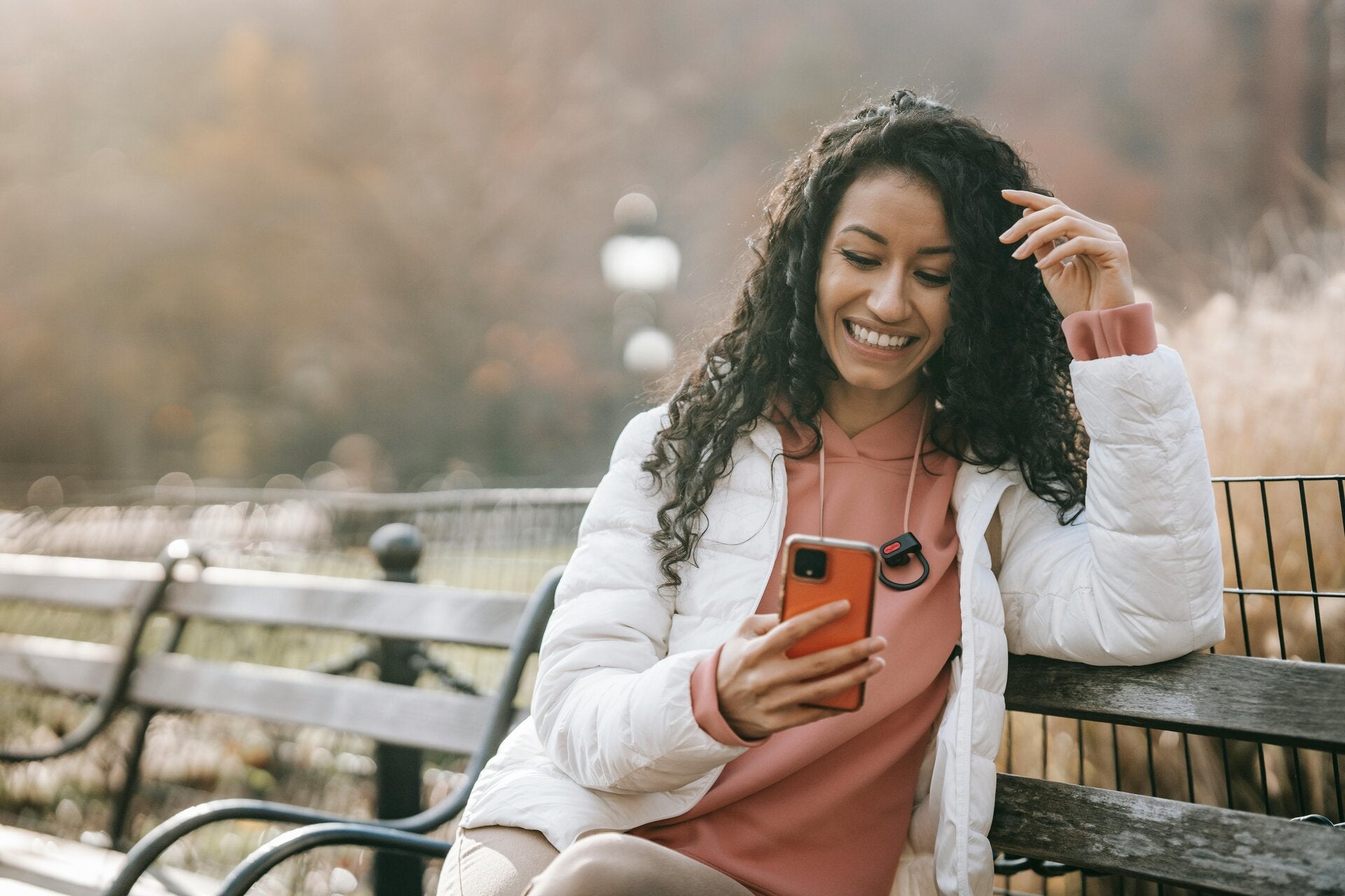 woman looking at cell phone smiling