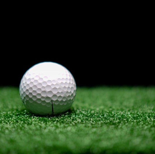 Artificial turf with golf ball