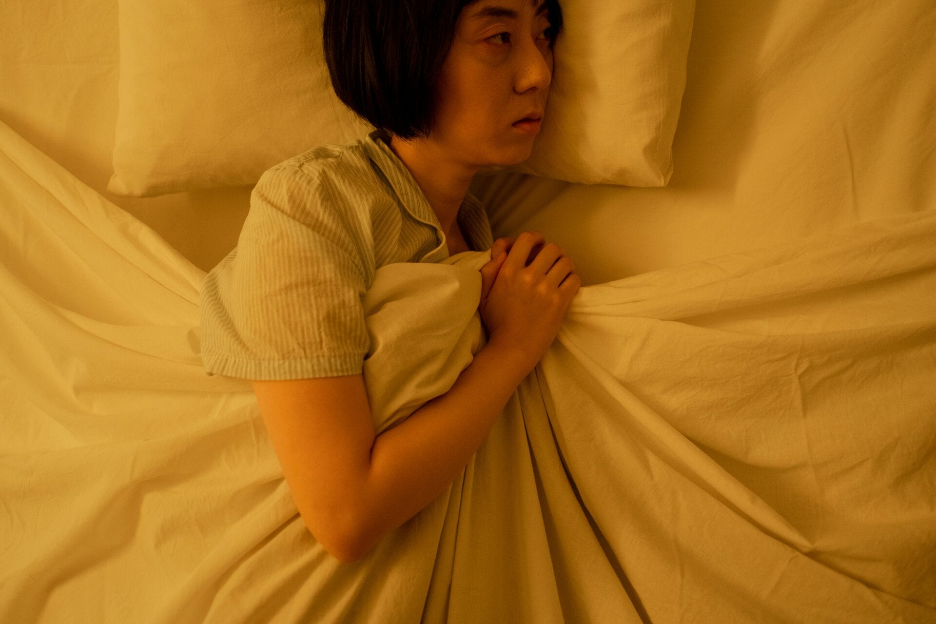 chinese lady unable to sleep in bed