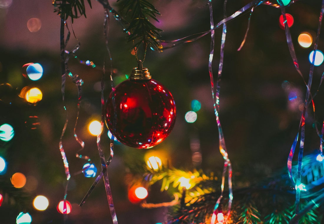 Festive lights and a red Christmas bauble