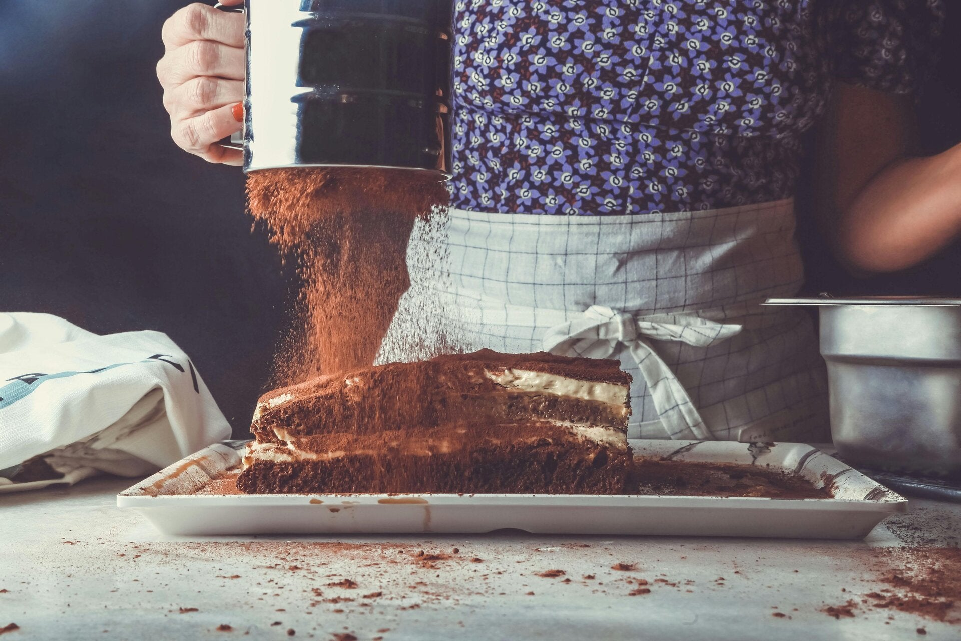 A beautiful Cannabis Tiramisu dusted with cocoa powder, a professional-grade dessert choice for cannabis edibles and Stoner Strategies readers