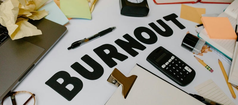 The word BURNOUT surrounded by stationary