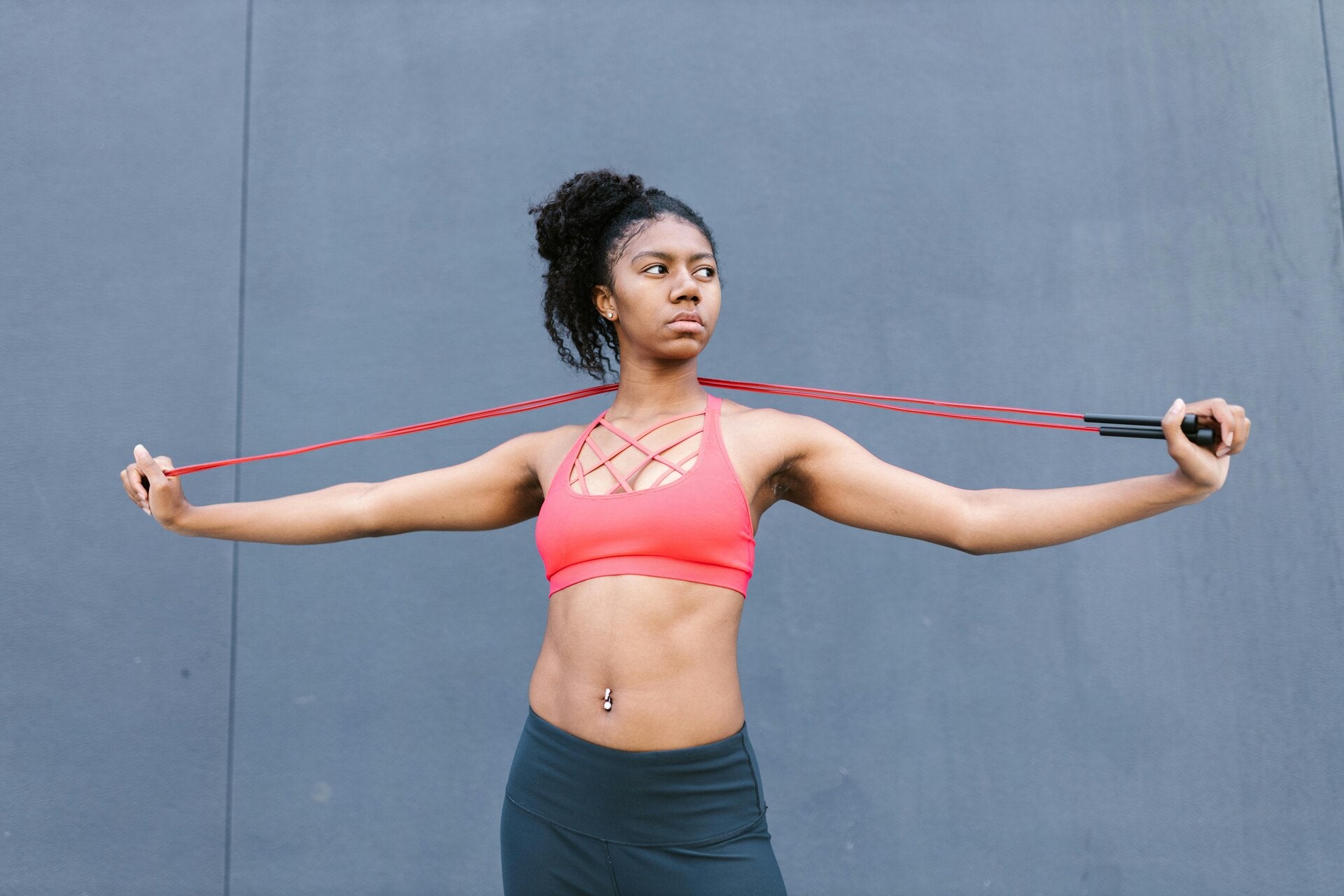 a lady holding a resistance band for exercise
