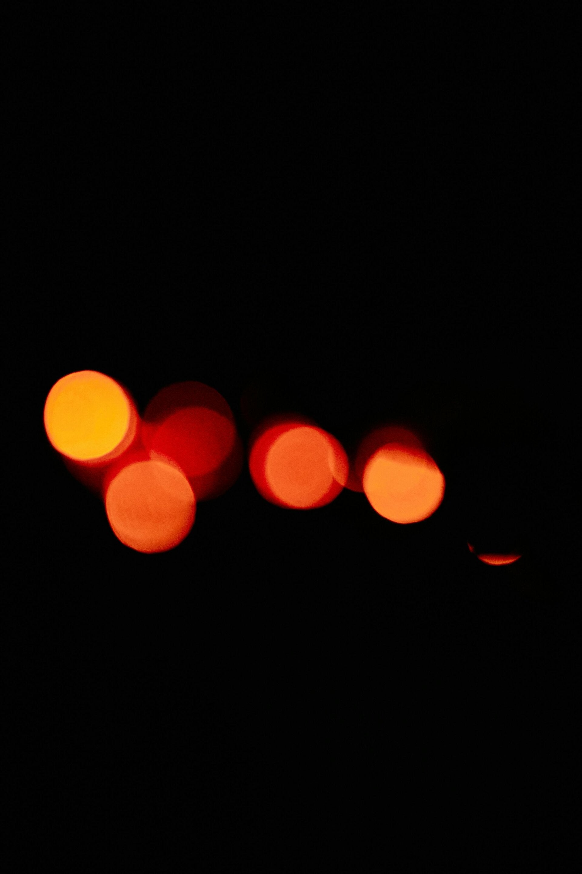 photo of yellow and orange lights against black background 