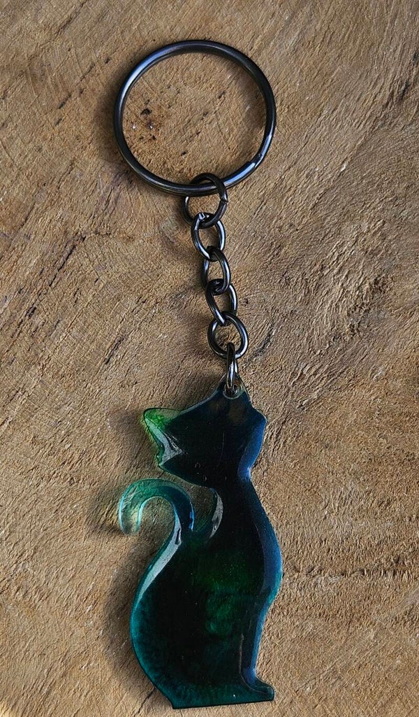 "Kleurrijke kattenkwaad" Sleutelhanger Zittend