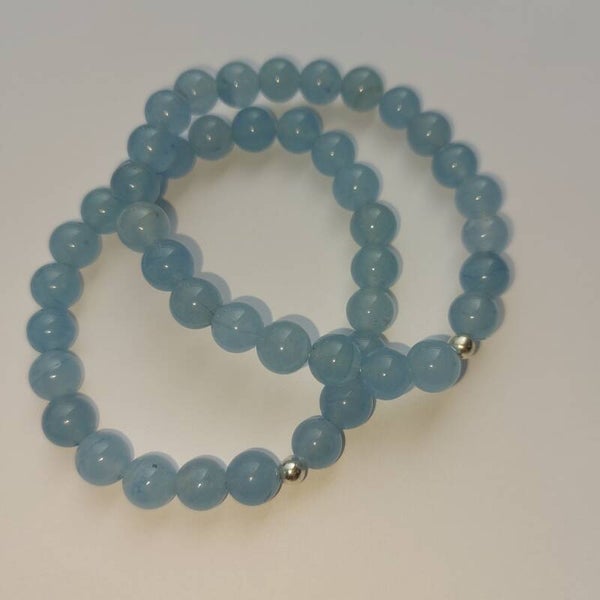 Aquamarijn armband 8 mm kralen met  een zilveren kraal
