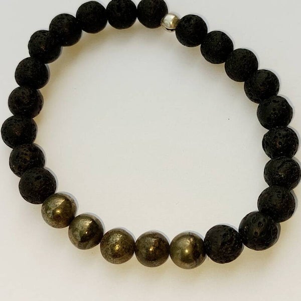 Lavasteen armband met centrepiece van bronziet kralen en een zilveren kraal