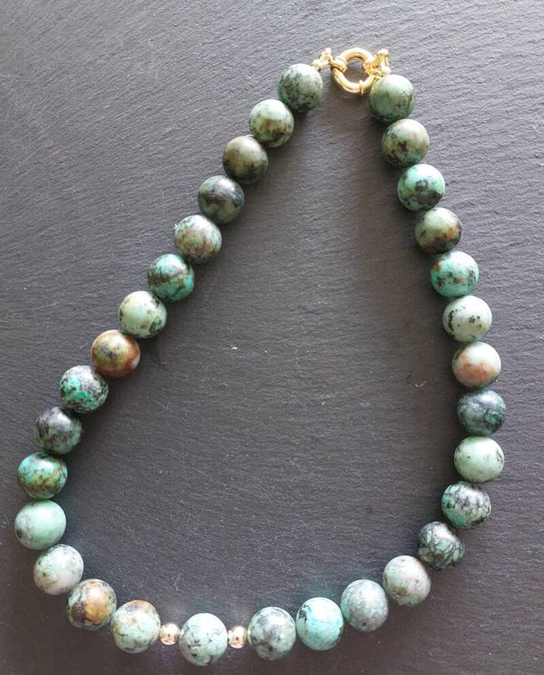 Turkoois ketting met gold plated tussenkralen en boeisluiting