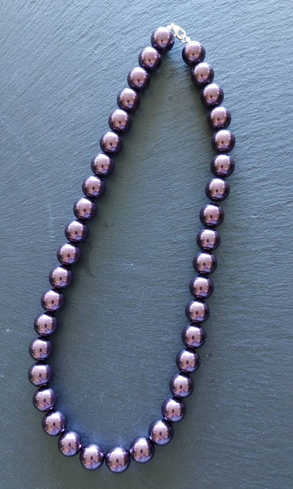 Paarse shell parelketting met zilveren 3 mm tussenkralen