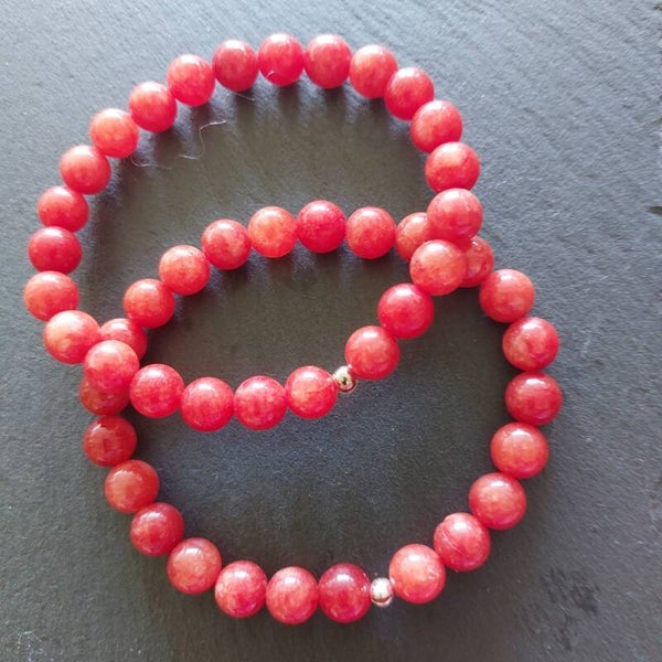 Oranje carneool armband van 8 mm kralen met zilveren kraal