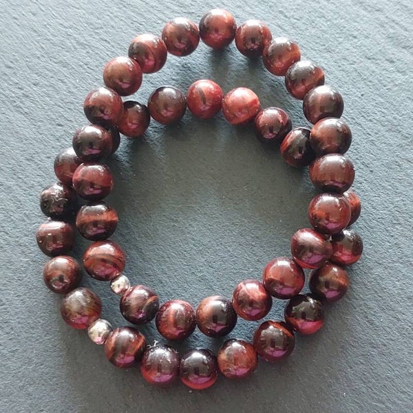 Roodbruine Tijgeroog armband met 8 mm kralen en een zilveren kraal