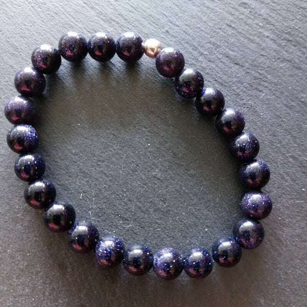 Blauwe goudsteen armband met zilveren kraal