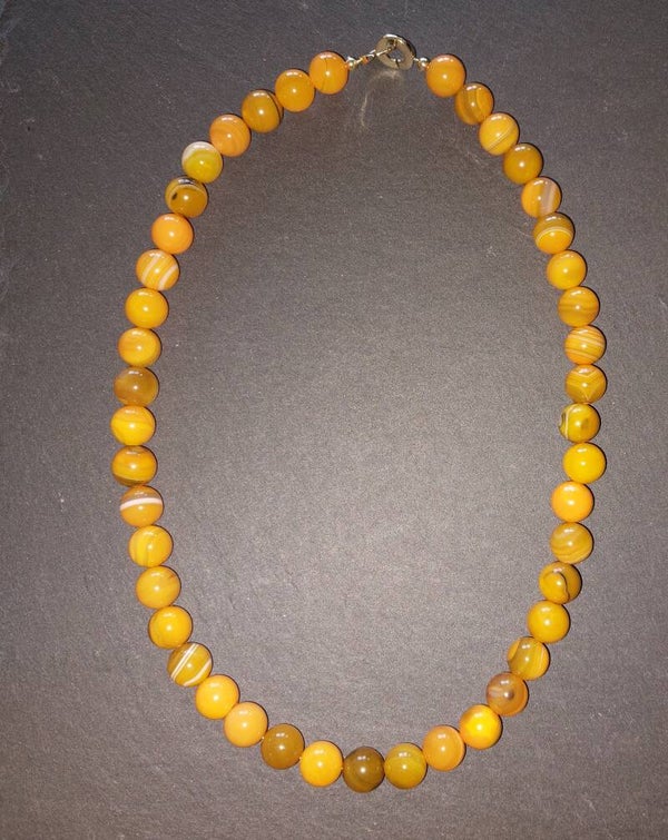 Oranje agaat ketting met gold plated puzzle sluiting