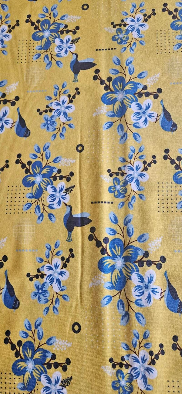 1042 Stoff Baumwolljersey - gelb mit Blumen und Kolibri