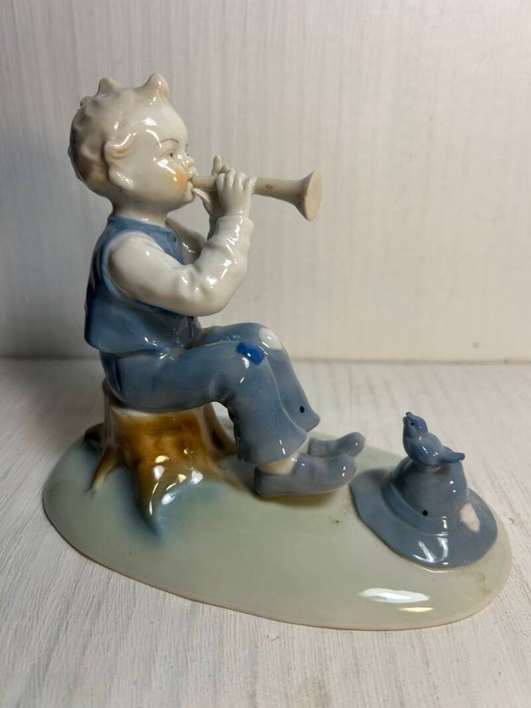 Boy Playing a Flute to a bird by Kunstporzellan llmenau  factory, East Germany