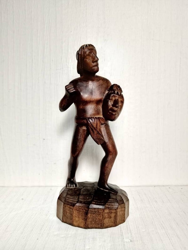 Hand carved wooden figurine of a Head Hunter