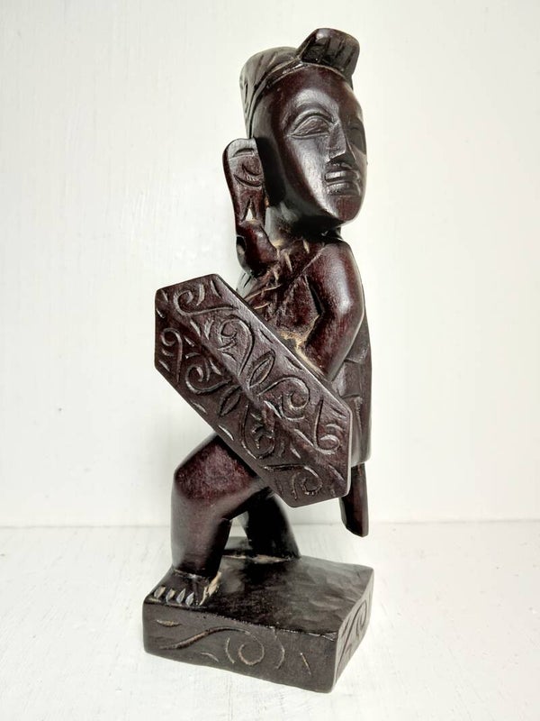 Hand carved wooden sarawak warrior figurine.