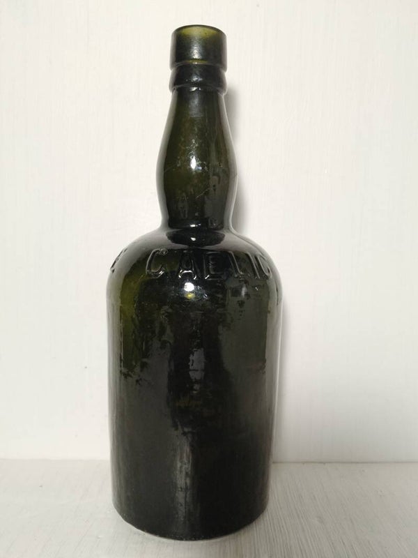 Vintage Gaelic whisky black bottle.
