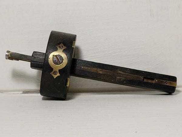 Victorian ebony and brass mortise gauge.
