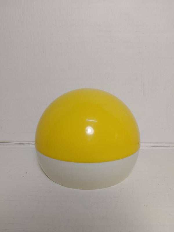 Retro vintage sewing kit in a yellow plastic orb with mirror on base.