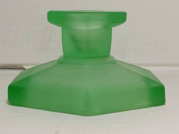 Frosted green depression glass candle holder.