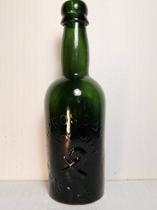 Antique English green beer bottle.