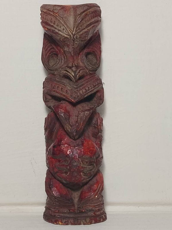 Carved wooden Tiki figurine.