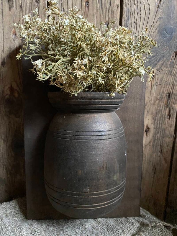 Houten paneel met sober houten halve pot
