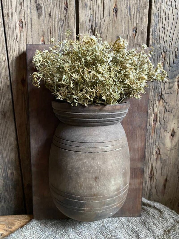Houten paneel met houten halve pot
