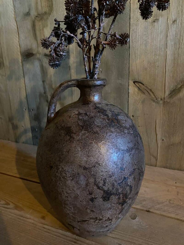 Gemêleerde bruine smalle kruik met oor