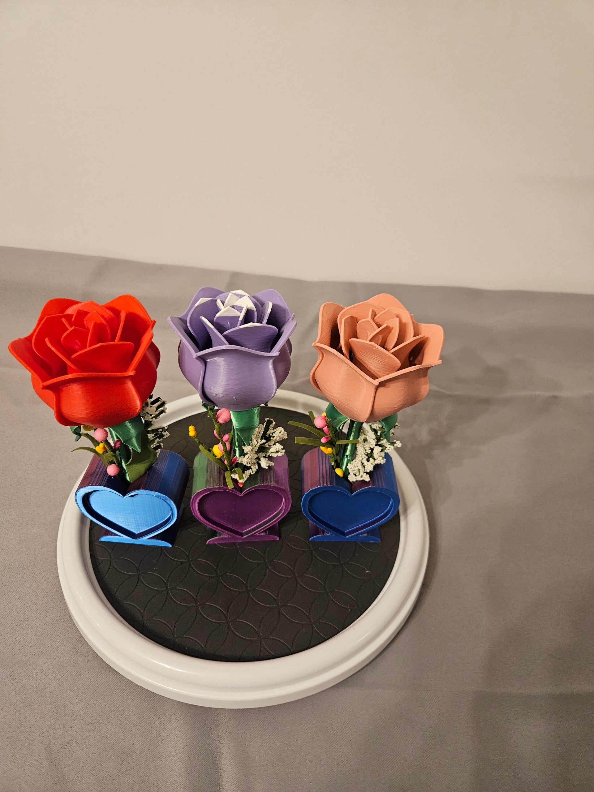 This has been my funest project , it has beautiful multi color heart base that sacurly holds the rose and its mix of beautiful flowers as well as a beautiful fresh cent. The roses are very beautiful and heavy as you see i can have fun changing the colors.