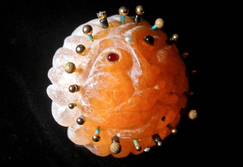 Mr Sunshine — Sculpted from vivid orange Selenite, sphere with 360-degree whorl of flames, set with jewels and gold. Selenite — Carrier of Light — Transmutes Negative to Positive