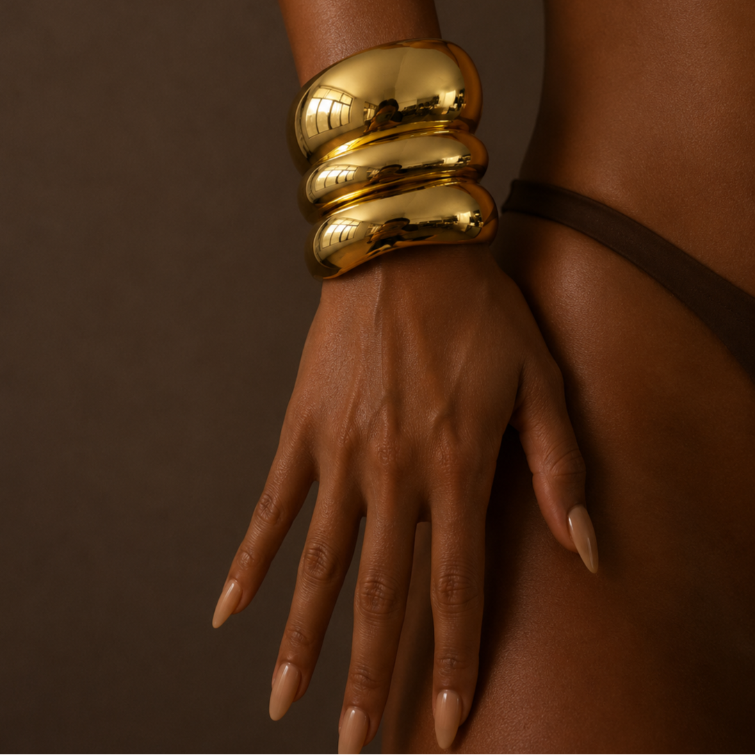 Set of three chunky stainless steel gold plated bracelets