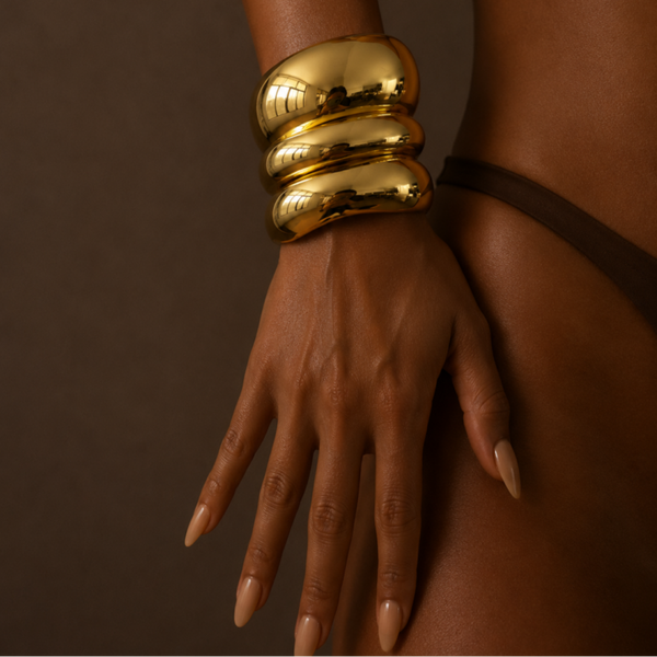 Set of three chunky stainless steel gold plated bracelets