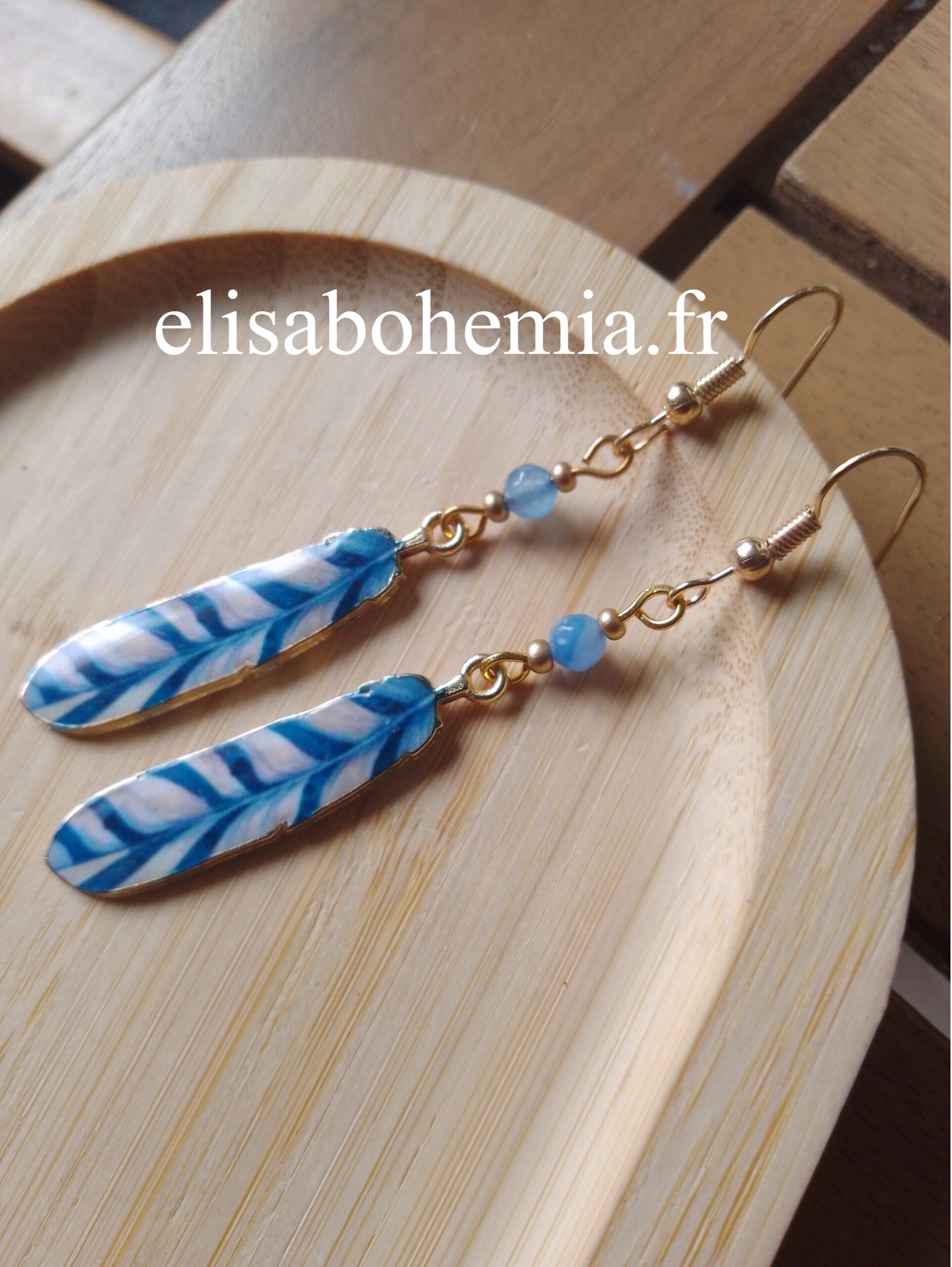 Boucles d'oreilles plumes bleues et blanches